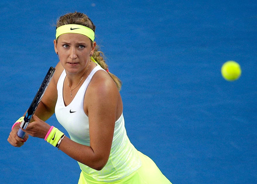 Victoria Azarenka of Belarus eyes on the ball for a return to Barbora Zahlavova Strycova of the Czech Republic during their third round match at the Australian Open tennis championship in Melbourne, Australia.