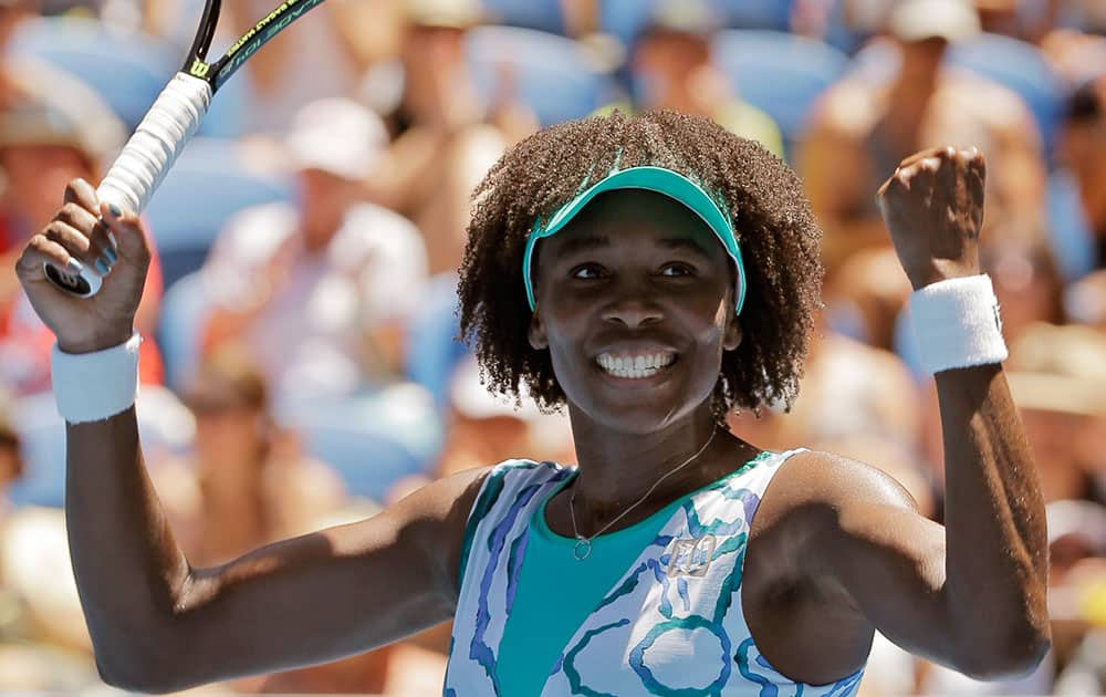 Venus Williams of the U.S. celebrates after defeating Camila Giorgi of Italy in their third round match at the Australian Open tennis championship in Melbourne, Australia.