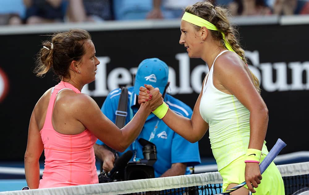 Victoria Azarenka of Belarus, right, is congratulated by Barbora Zahlavova Strycova of the Czech Republic after winning their third round match at the Australian Open tennis championship in Melbourne, Australia.