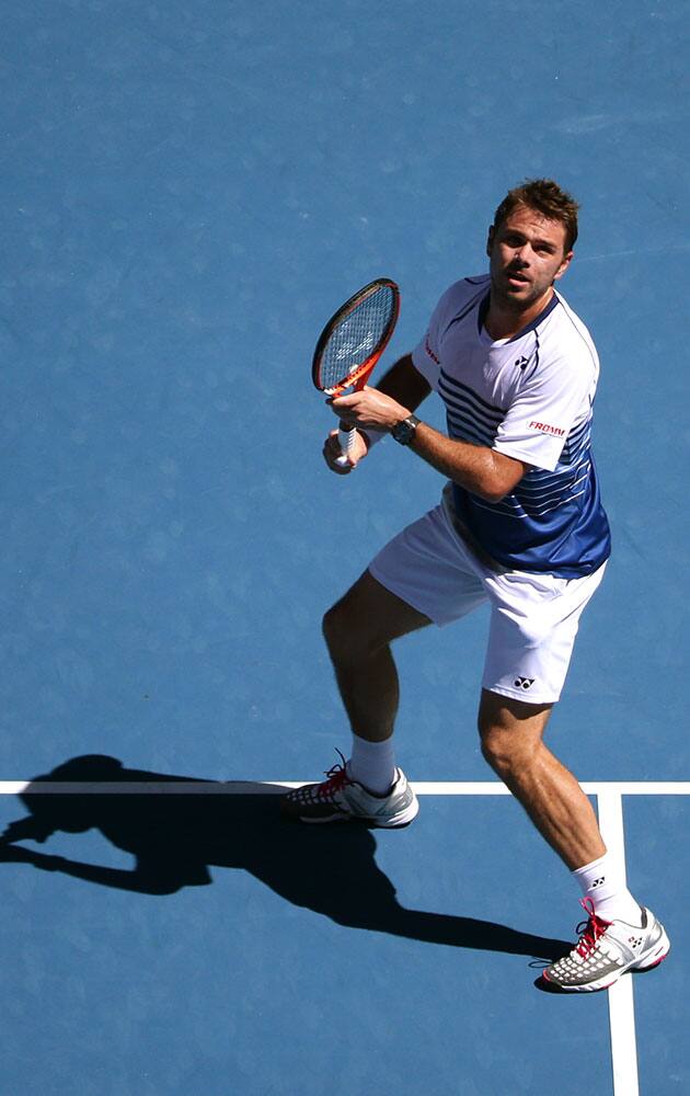 Stan Wawrinka of Switzerland looks up for a shot from Jarkko Nieminen of Finlan dduring their third round match at the Australian Open tennis championship in Melbourne, Australia.