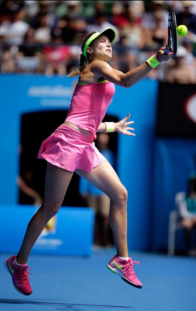 Eugenie Bouchard of Canada makes a forehand return to Irina-Camelia Begu of Romania during their fourth round match at the Australian Open tennis championship in Melbourne, Australia.