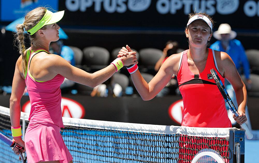 Eugenie Bouchard of Canada, left, is congratulated by Irina-Camelia Begu of Romania after winning their fourth round match at the Australian Open tennis championship in Melbourne, Australia.