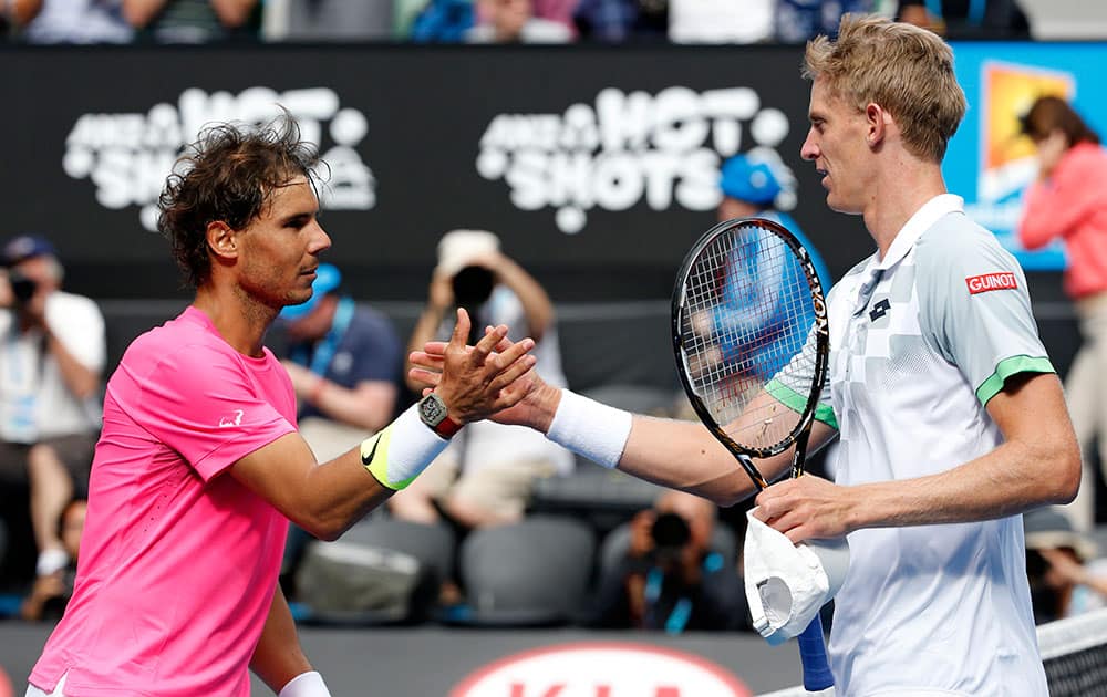 Rafael Nadal of Spain, left, shakes hands with Kevin Anderson of South Africa after winning their fourth round match at the Australian Open tennis championship in Melbourne, Australia.