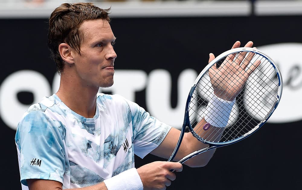 Tomas Berdych of the Czech Republic celebrates after defeating Bernard Tomic of Australia in their fourth round match at the Australian Open tennis championship in Melbourne, Australia.