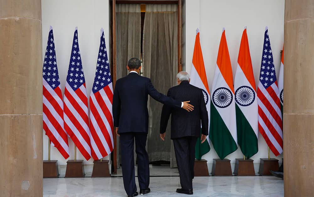 President Barack Obama and Indian Prime Minister Narendra Modi walk into Hyderabad House for a meeting in New Delhi, India.