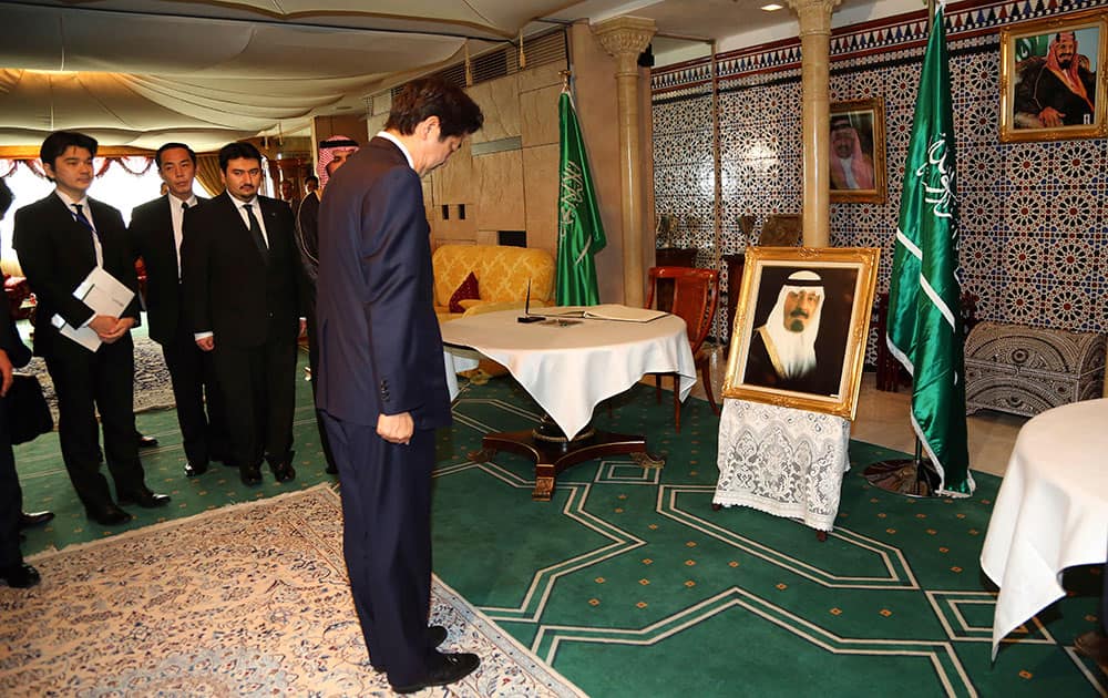 Japanese Prime Minister Shinzo Abe bows after signing a condolence book for the late King Abdullah of Saudi Arabia at Saudi Arabia Embassy in Tokyo.