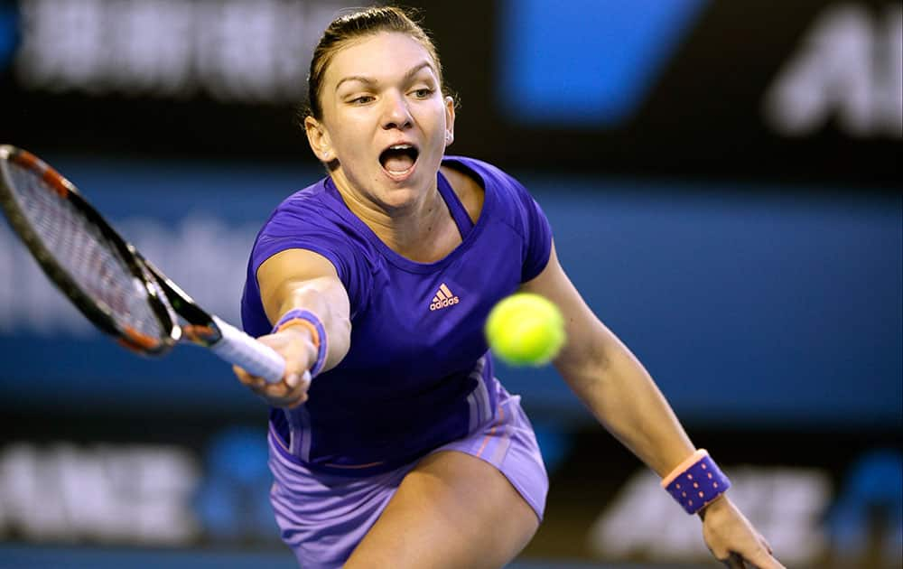 Simona Halep of Romania makes a forehand return to Yanina Wickmayer of Belgium during their fourth round match at the Australian Open tennis championship in Melbourne, Australia.