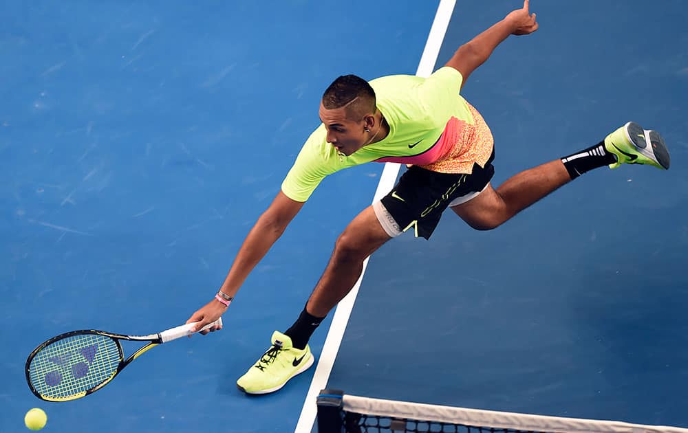 Nick Kyrgios of Australia chases down a shot to Andreas Seppi of Italy during their fourth round match at the Australian Open tennis championship in Melbourne, Australia, Sunday.