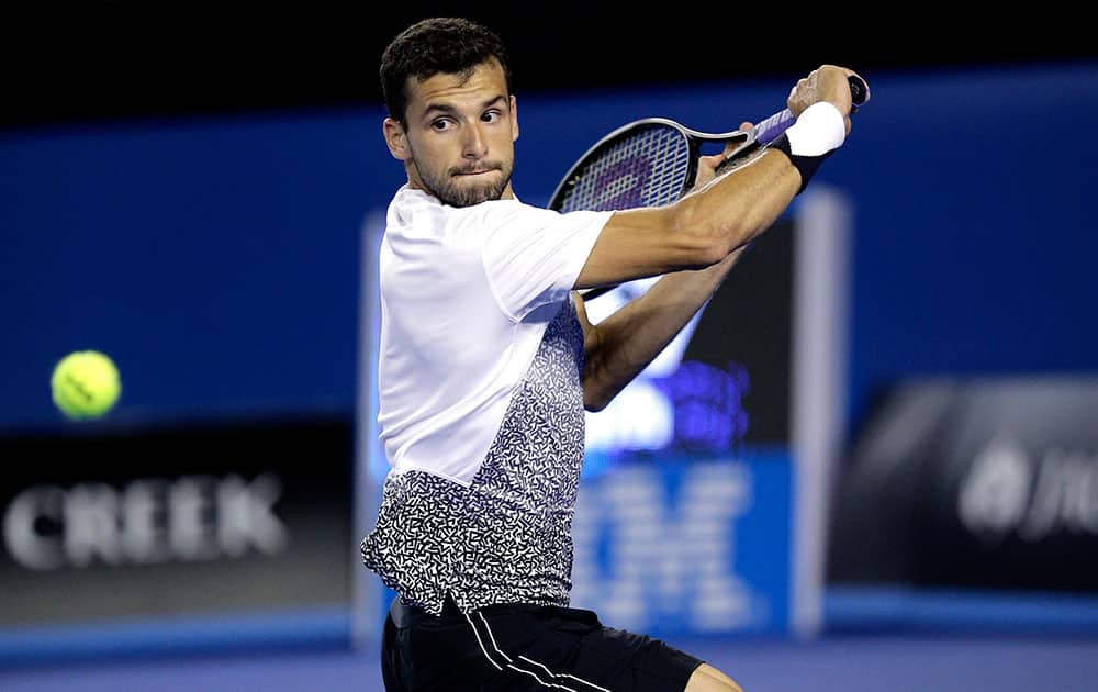 Grigor Dimitrov of Bulgaria plays a shot to Andy Murray of Britain during their fourth round match at the Australian Open tennis championship in Melbourne, Australia, Sunday.