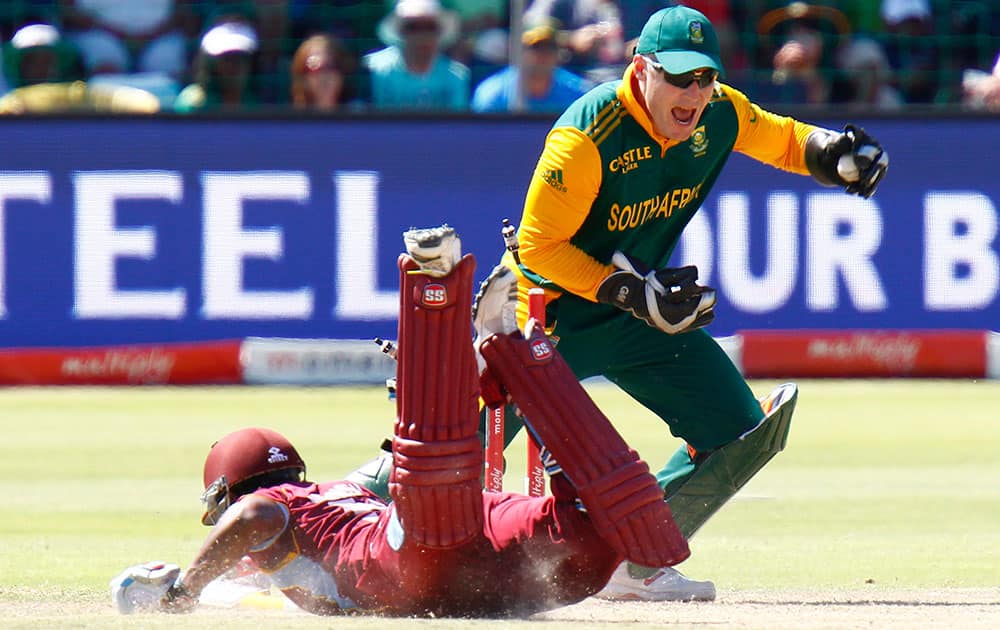 South Africa's Morne van Wyk runs out West Indies' Leon Johnson during their one day international cricket match, in Port Elizabeth, South Africa, Sunday.