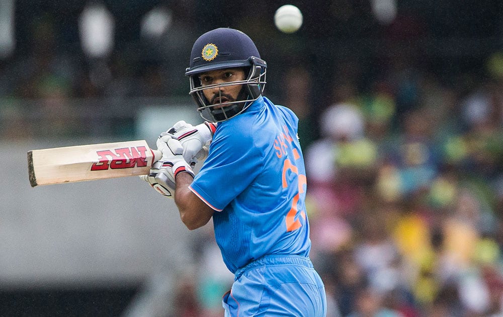 Shikhar Dhawan edges a ball to Australian Aaron Finch and is caught out during their one-day international cricket match in Sydney.