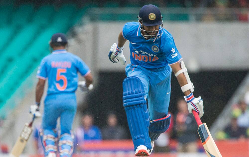 Ajinkya Rahane runs through for a quick single during their one day international cricket match in Sydney.