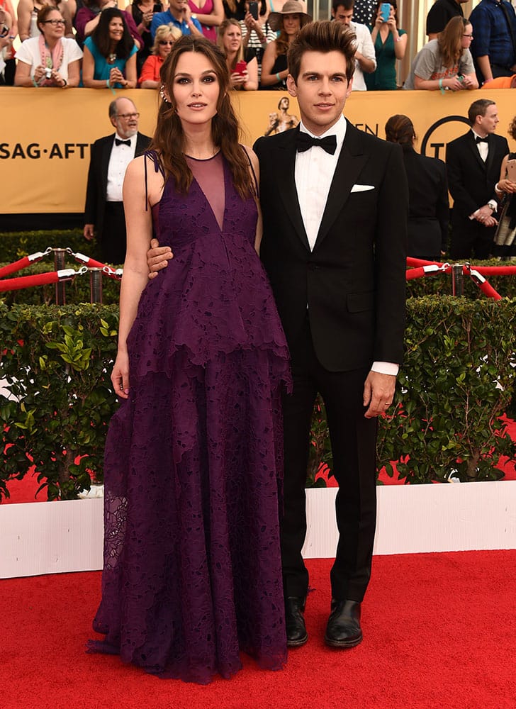 Keira Knightley, left, and James Righton arrive at the 21st annual Screen Actors Guild Awards at the Shrine Auditorium, in Los Angeles.