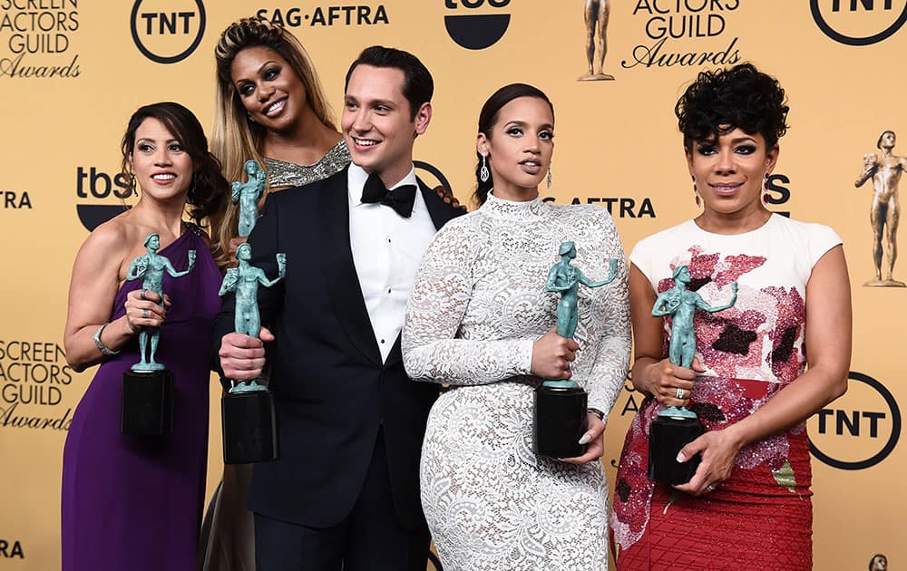 Elizabeth Rodriguez, Laverne Cox, Matt McGorry, Dascha Polanco and Selenis Leyva pose in the press room with the award for outstanding ensemble in a comedy series for 'Orange is the New Black' at the 21st annual Screen Actors Guild Awards at the Shrine Auditorium, in Los Angeles.