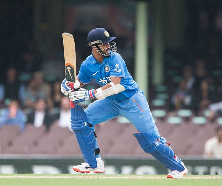 Ajinkya Rahane hits a ball to the boundary for 4 during their one day international cricket match in Sydney.