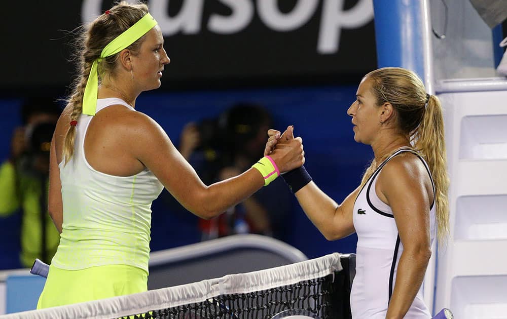 Dominika Cibulkova of Slovakia, right, shakes hands with Victoria Azarenka of Belarus after winning their fourth round match at the Australian Open tennis championship in Melbourne, Australia.