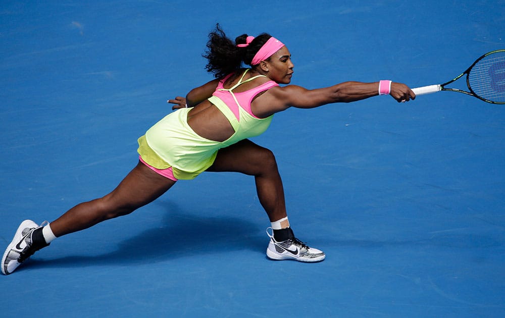 Serena Williams of the U.S. reaches out for a shot to Garbine Muguruza of Spain during their fourth round match at the Australian Open tennis championship in Melbourne, Australia.