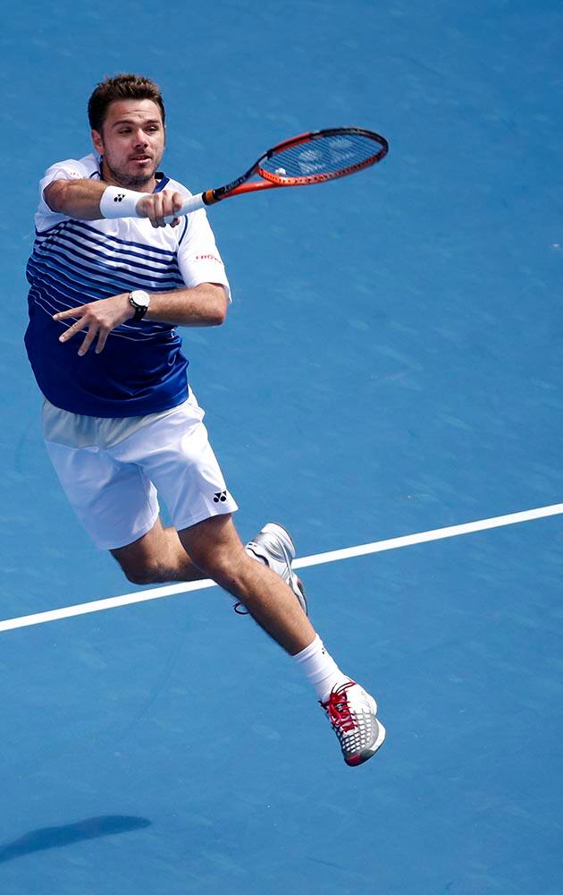 Stan Wawrinka of Switzerland leaps for a return shot to Guillermo Garcia-Lopez of Spain during their fourth round match at the Australian Open tennis championship in Melbourne, Australia.