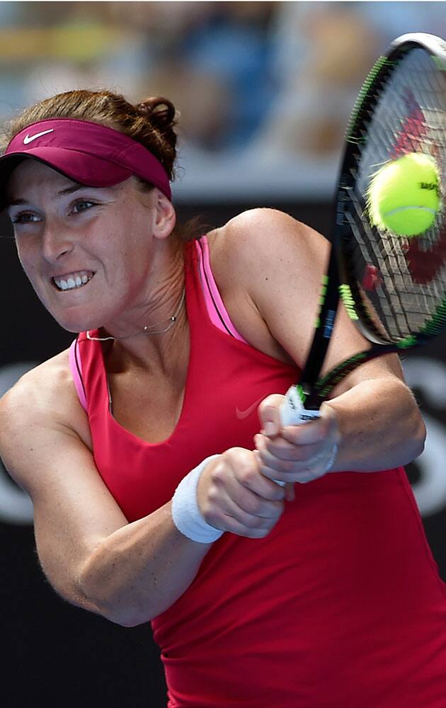 Madison Brengle of the U.S. makes a backhand return to her compatriot Madison Keys during their fourth round match at the Australian Open tennis championship in Melbourne, Australia.