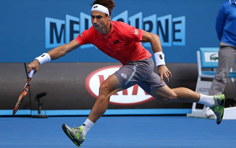 David Ferrer of Spain chases down a shot to Kei Nishikori of Japan during their fourth round match at the Australian Open tennis championship in Melbourne, Australia.