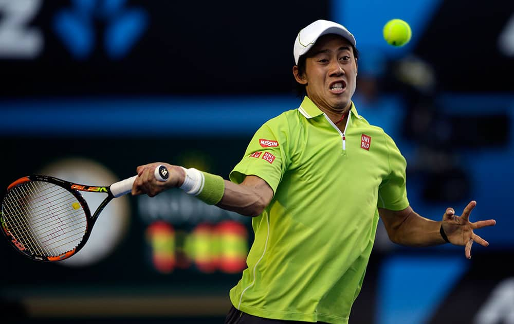 Kei Nishikori of Japan makes a forehand return to David Ferrer of Spain during their fourth round match at the Australian Open tennis championship in Melbourne, Australia.