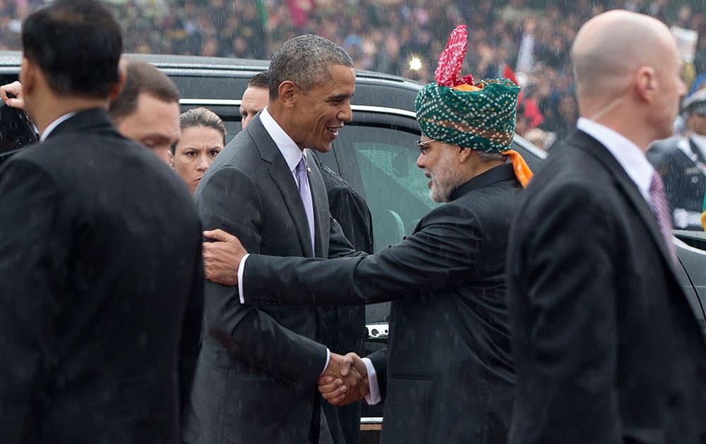 US President Barack Obama, is greeted by Prime Minister Narendra Modi as he arrives for Republic Day in New Delhi.