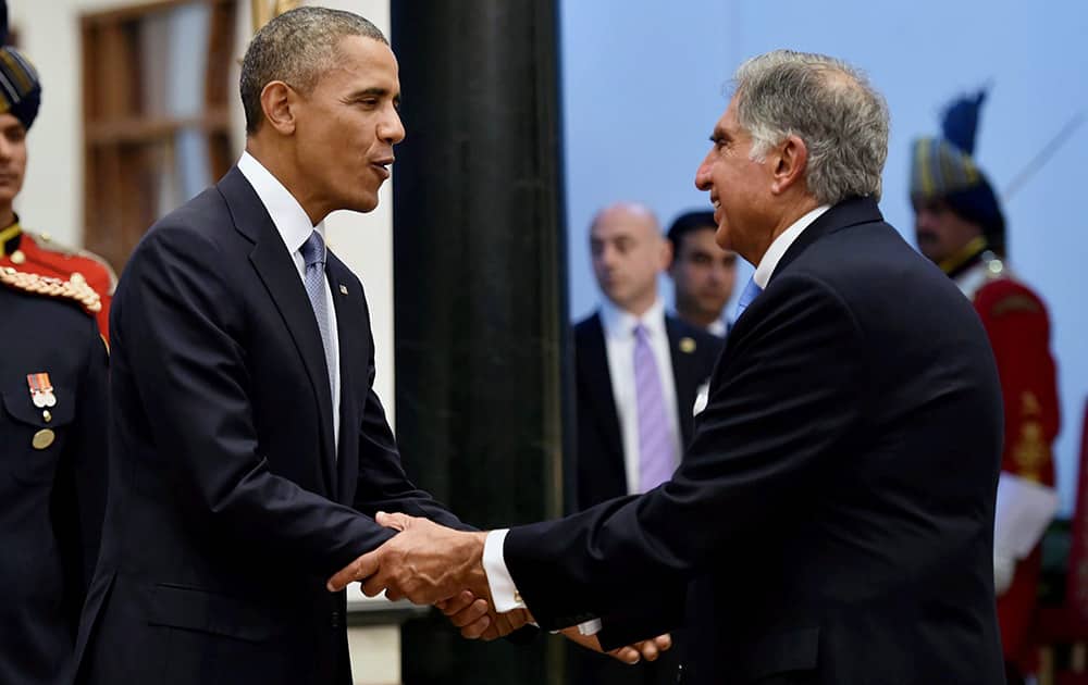 US President Barack Obama shakes hands with industrialist and chairman Emeritus of Tata Sons, Ratan Tata during a banquet hosted at the Rashtrapati Bhavan in New Delhi.