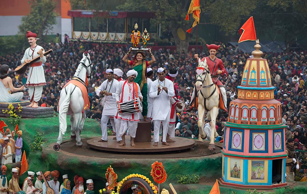 Performers spin around atop a float during the Republic Day Parade in New Delhi. President Barack Obama is the Chief Guest for this year's parade.