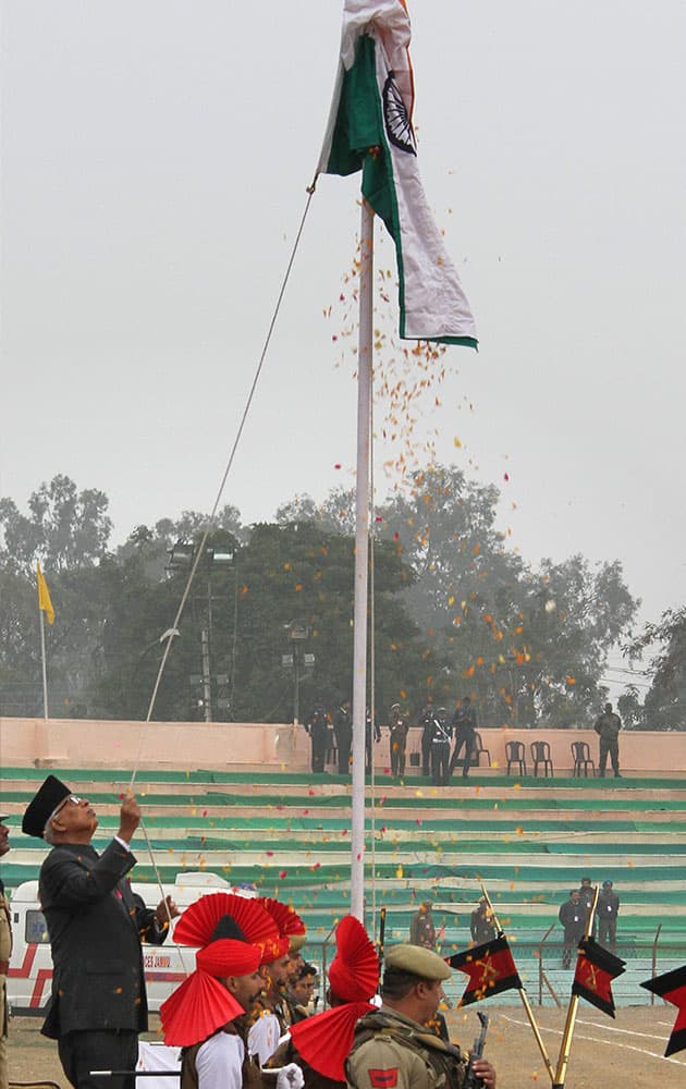 Jammu and Kashmir Governor N N Vohra hoists the national flag during Republic Day celebrations at MA Stadium in Jammu on Monday.