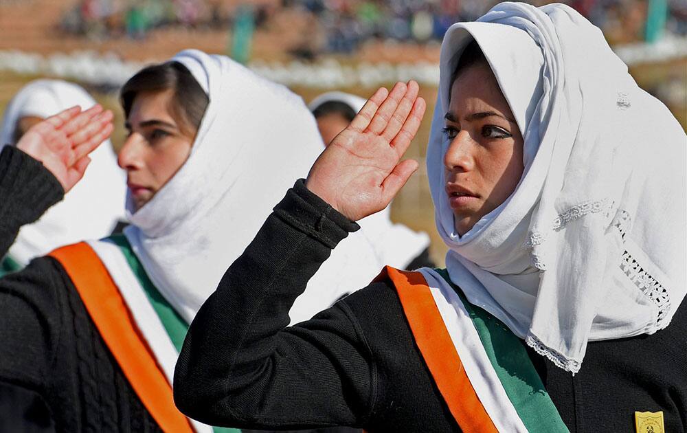 School girls march during the 66th Republic day Parade at Bakshi Satdium in Srinagar on Monday. 