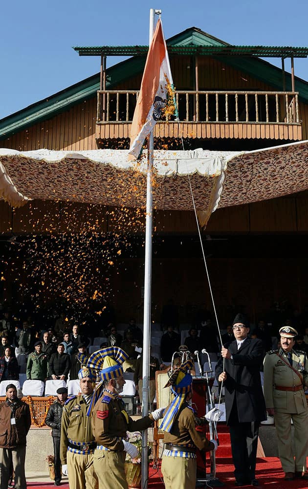 Divisional Commissioner Kashmir, Rohit Kansal unfurling the Tricolour during the 66th Republic day Parade at Bakshi Satdium in Srinagar on Monday.