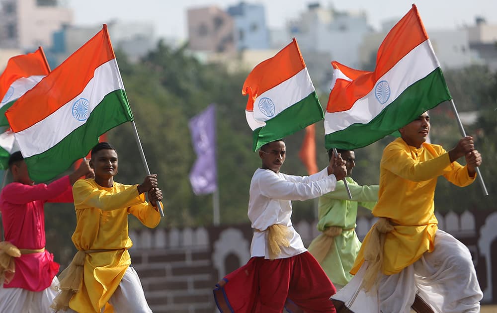 Paramilitary soldiers hold national flags and perform during Republic Day celebrations in Hyderabad. Indians across the country celebrated Republic day, which commemorates the 1950 adoption of its constitution.