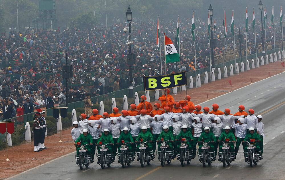 Border Security Force soldiers perform a motorcycle stunt during Republic Day parade in New Delhi.