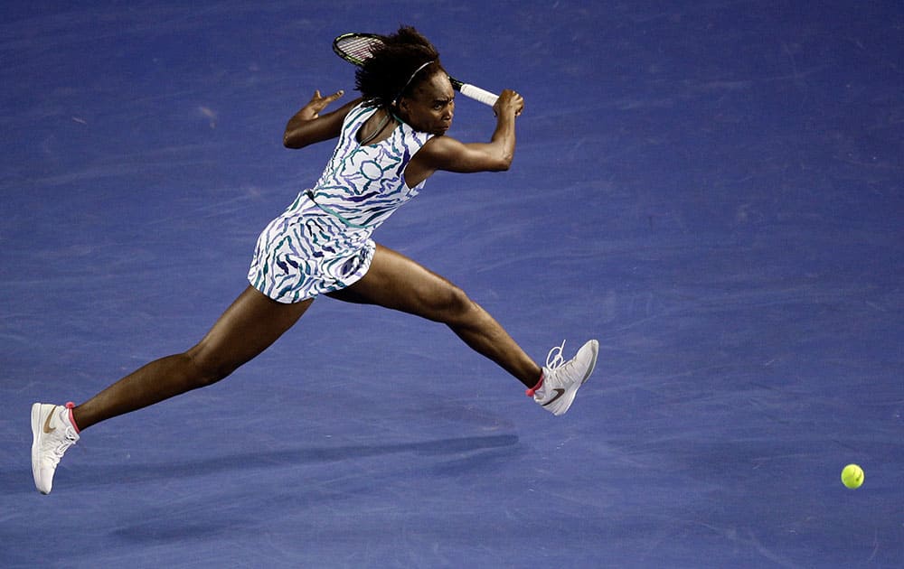 Venus Williams of the U.S. chases down a shot to Agnieszka Radwanska of Poland during their fourth round match at the Australian Open tennis championship in Melbourne, Australia, Monday.