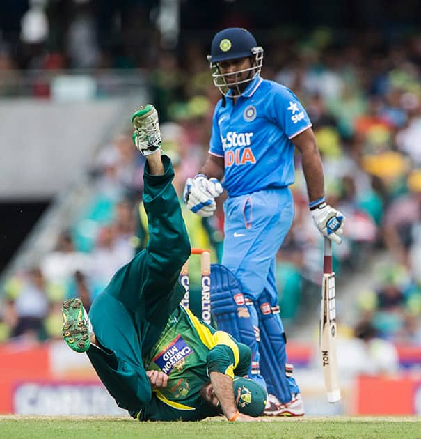 Australian Glen Maxwell goes for a tumble in an attempt to run out Ambati Rayudu during their one day international cricket match in Sydney.