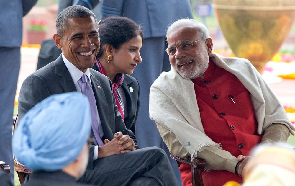 President Barack Obama and Prime Minister Narendra Modi, smile as they talk during a reception in the Mughal Gardens of the Rashtrapati Bhavan presidential palace in New Delhi.