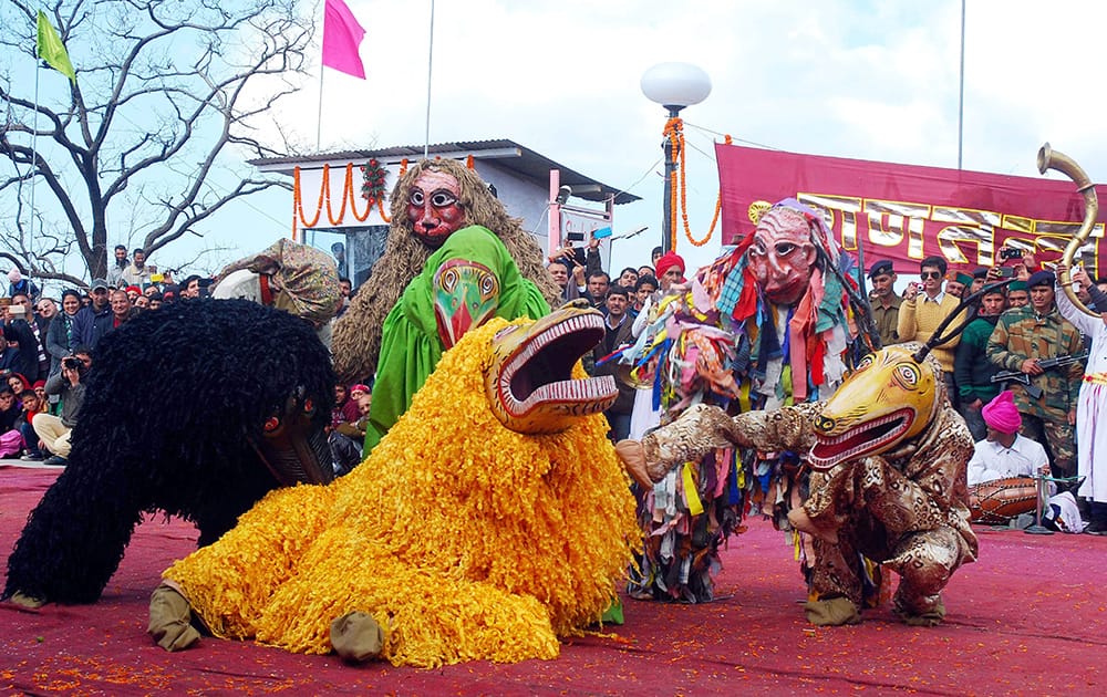 Artists perform traditional dance during the 66th Republic Day celebrations at the Ridge in Shimla.