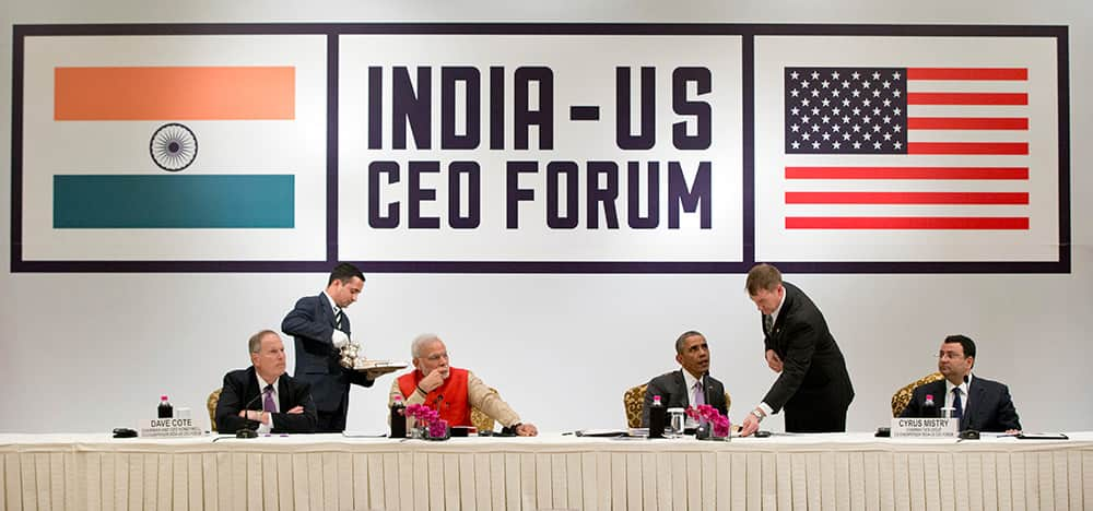 Dave Cote, CEO, Honeywell, Prime Minister Narendra Modi, US President Barack Obama, and Cyrus Mistry, Chairman, Tata Group, are served tea as they participate in a CEO roundtable discussion at the The Taj Mahal Hotel in New Delhi.