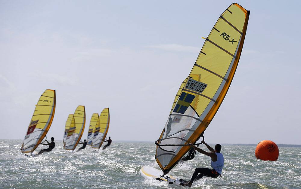 A boat from Sweden approaches the mark in the RS:X class during the ISAF Sailing World Cup Miami on Biscayne Bay, in Miami. 