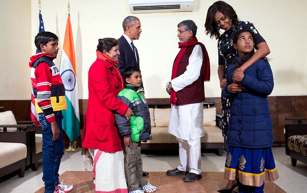 U.S. President Barack Obama and first lady Michelle Obama meet with Kailash Satyarthi, and his wife Sumedha Satyarth, with Deepak, Payal Jangid and Ayub Khan, at the Siri Fort Auditorium in New Delhi.