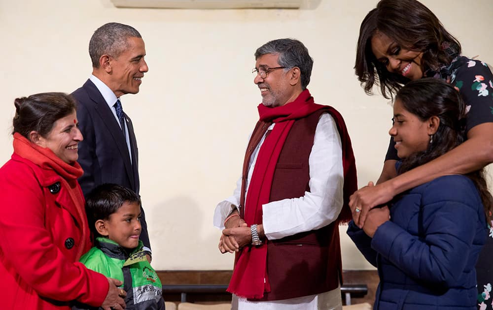 U.S. President Barack Obama and first lady Michelle Obama meet with Kailash Satyarthi, his wife Sumedha Satyarth, with Deepak, and Payal Jangid, at the Siri Fort Auditorium in New Delhi.