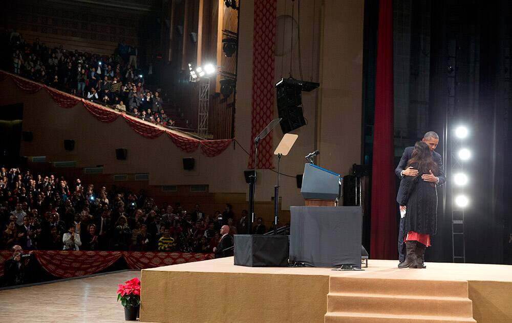 U.S. President Barack Obama embraces Pravah CEO, Neha Buch after she introduced him to speak at the Siri Fort Auditorium in New Delhi.