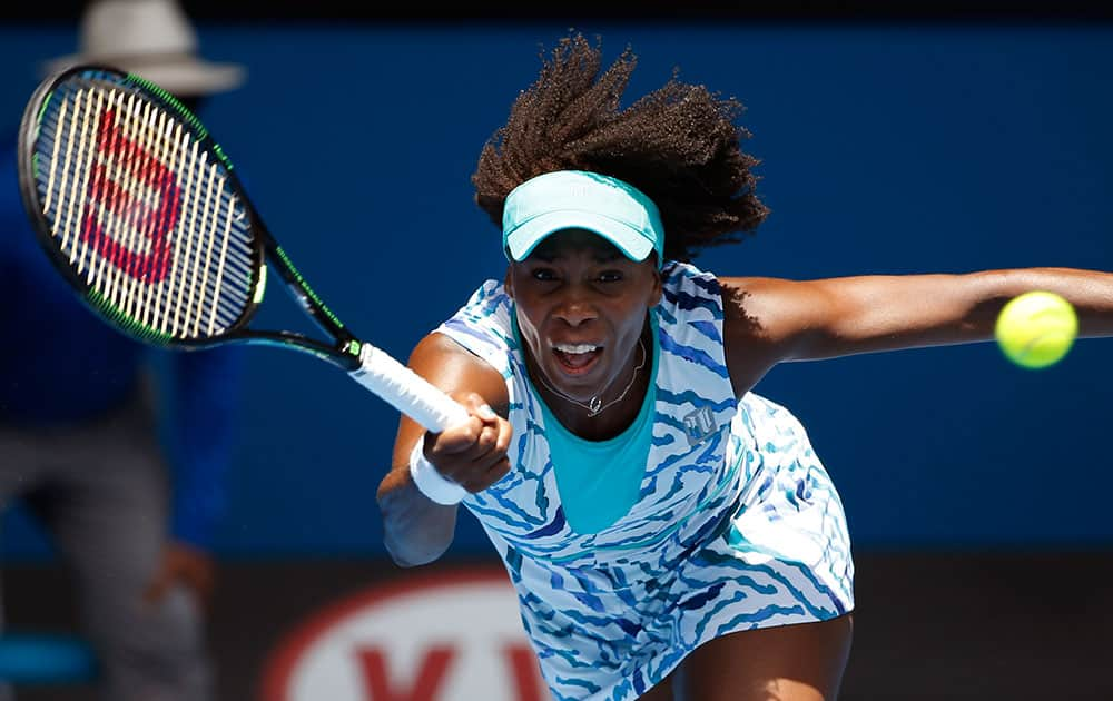 Venus Williams of the U.S. makes a forehand return to her compatriot Madison Keys during their quarterfinal match at the Australian Open tennis championship.