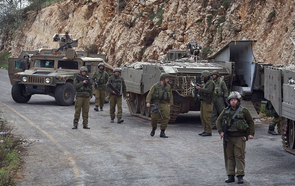 Israeli soldiers secure the Israel-Lebanon Border. The Lebanese Hezbollah group is claiming responsibility for today's attack on an Israeli military convoy.