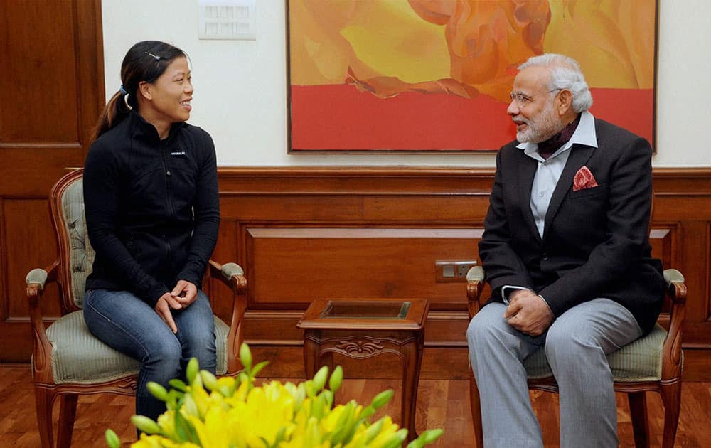 Olympic medal winner Boxer MC Mary Kom during a meeting with the Prime Minister Narendra Modi.