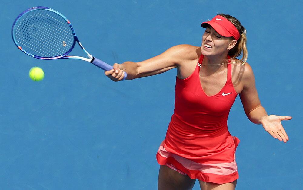 Maria Sharapova of Russia makes a forehand return to her compatriot Ekaterina Makarova during their semifinal match at the Australian Open tennis championship.