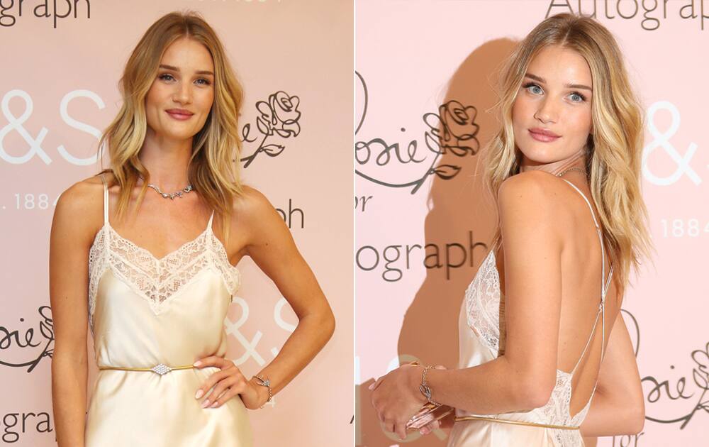 British model Rosie Huntington Whiteley poses for photographers at the photo call, unveiling her new perfume at a central London store.