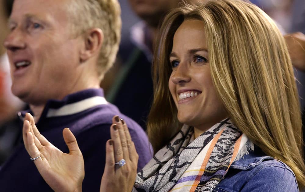 Kim Sears, fiancee of Andy Murray of Britain applauds after Murray's semifinal win over Tomas Berdych of the Czech Republich at the Australian Open tennis championship in Melbourne, Australia.