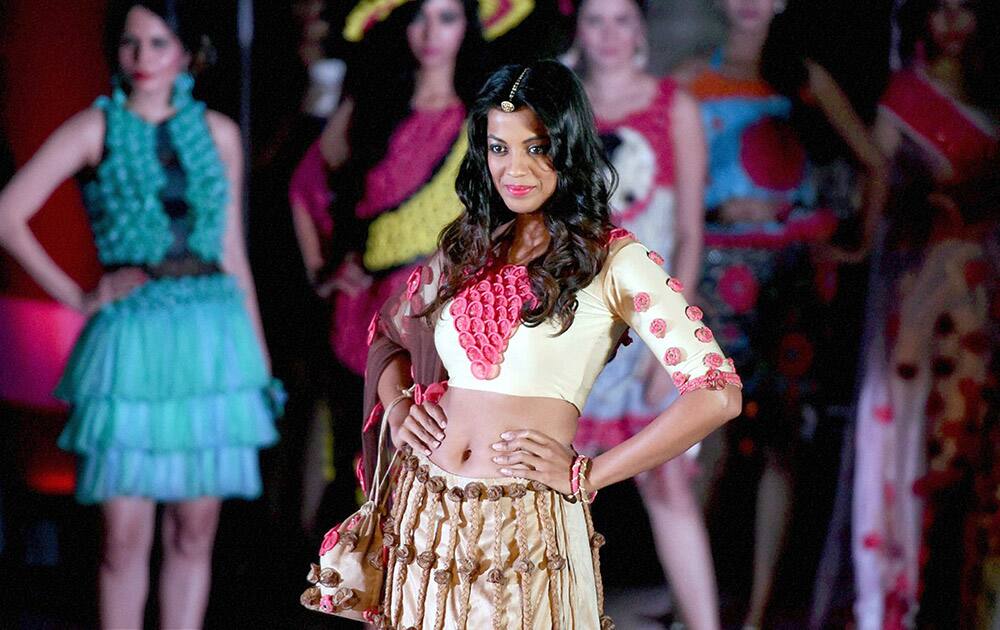 Bollywood actress Mugdha Ghodse walks the ramp during fashion show in Mumbai.