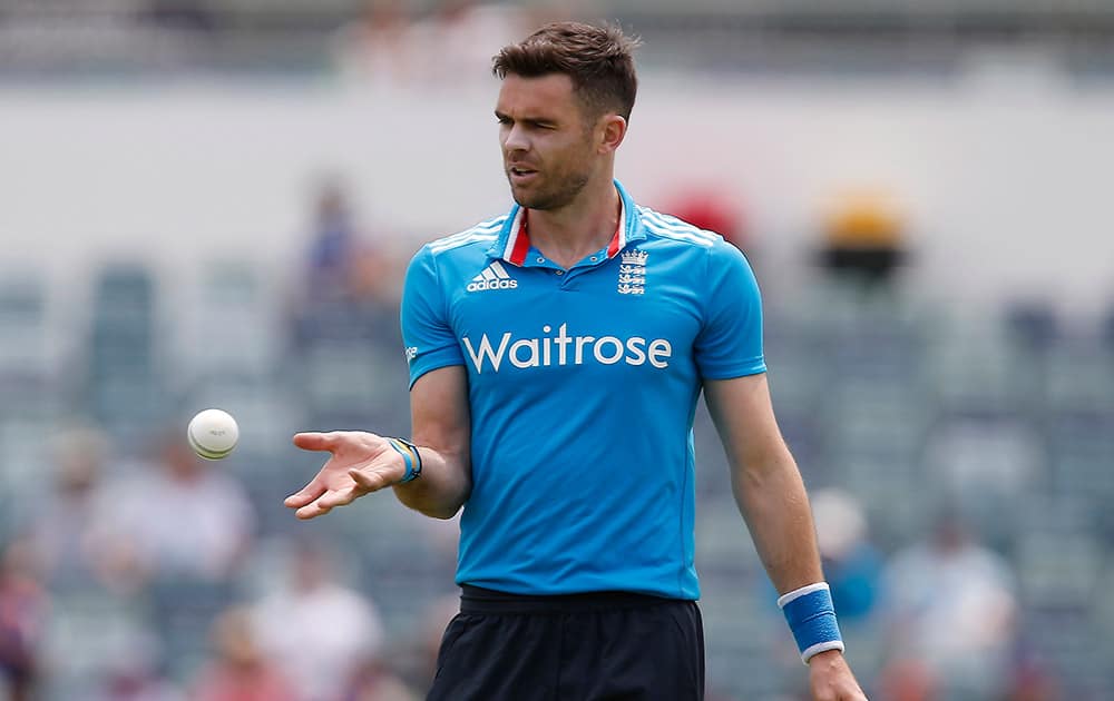 England's James Anderson catches the ball prior to bowling a delivery during their one-day international cricket match against India in Perth, Australia.